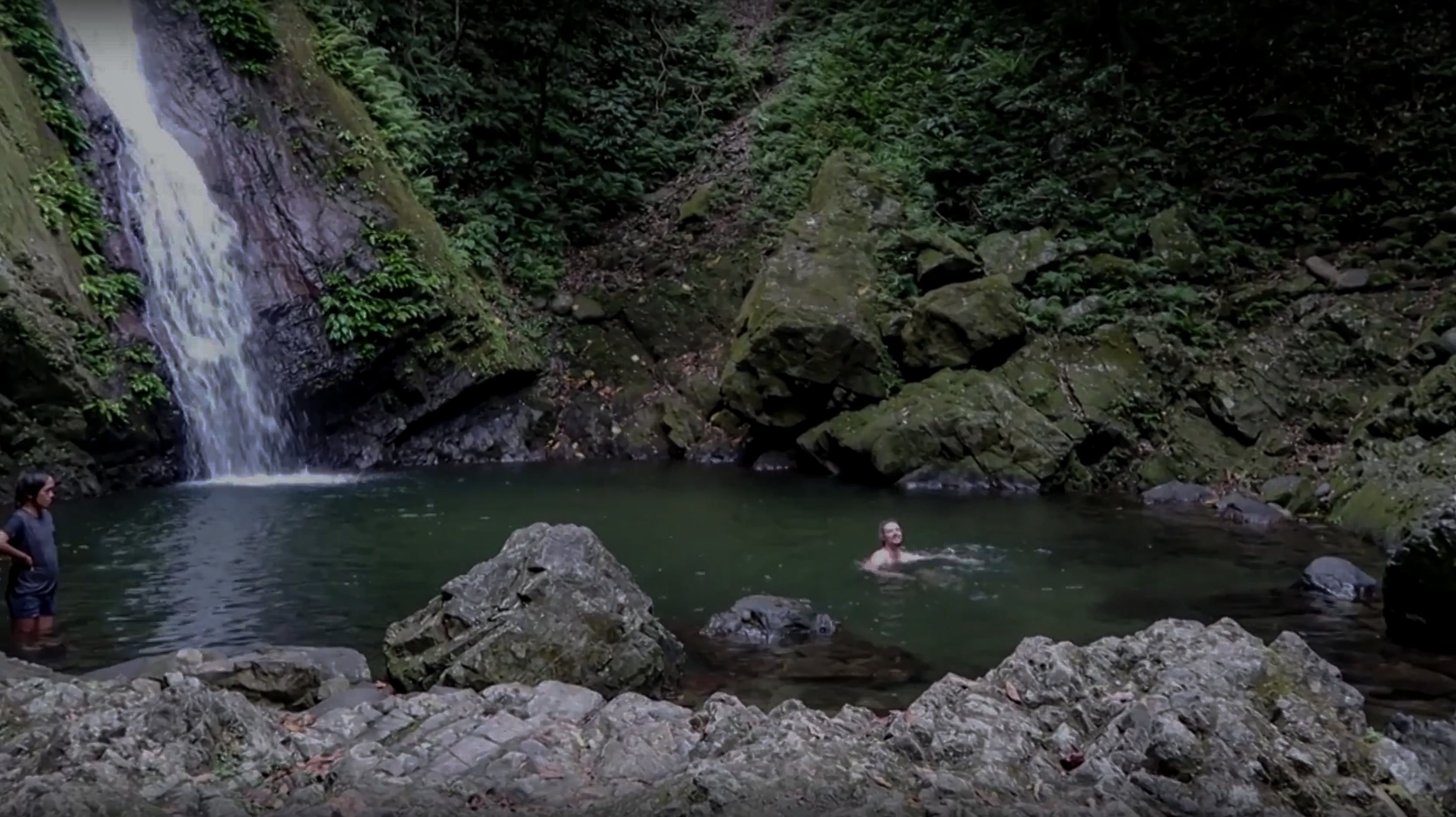 lenny through paradise swimming in the basin of water of kabigan falls in pagudpud ilocos norte philippines